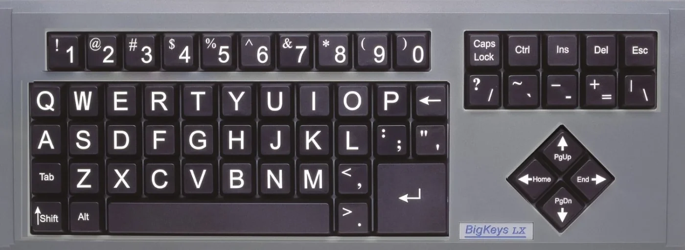The image is a close-up photograph of a computer keyboard with large keys. The keyboard is gray with black keys and white lettering.