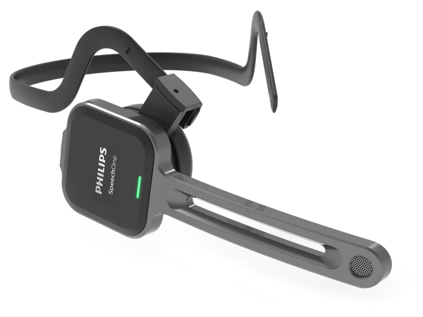 The image is a close-up product shot of a black and silver Philips SpeechOne headset. The headset is wireless, with a band that goes over the top of the head and an adjustable microphone arm. The microphone arm has a metallic gray finish and ends in a circular grille.